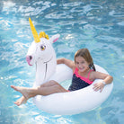 The girl is floating with Wham-O Splash Unicorn Pool Float