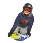 A boy is sitting on the Wham-O Snowboogie® GT 42"
