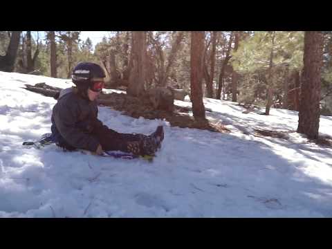 A boy is sliding with on the Wham-O Snowboogie® GT 42"