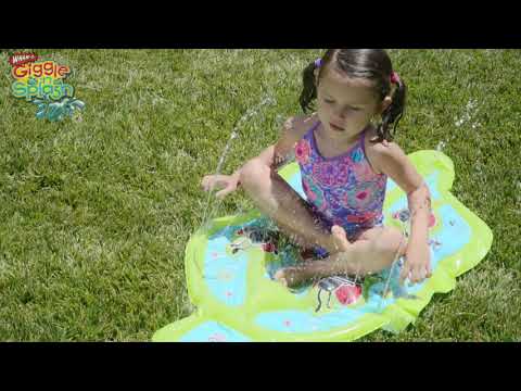 Girls are having fun in the Wham-O Giggle 'n Splash Lady Bug Sprinkle and Splash Play Mat 48"