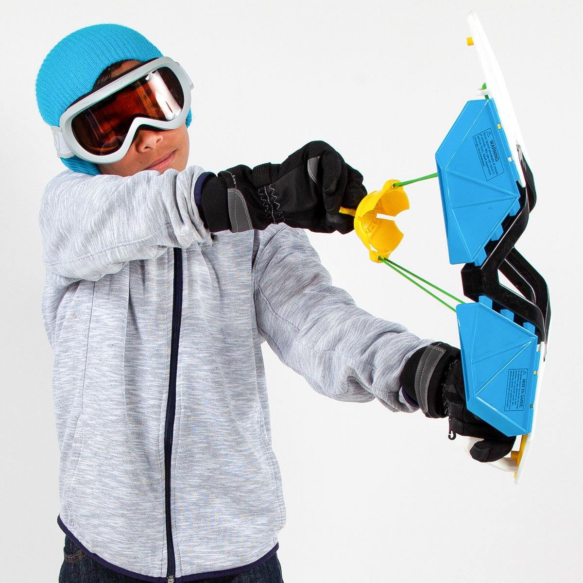 A boy is holding Wham-O Arctic Force Snow Bow