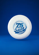 White Frisbee with blue 75th anniversary graphic and text, on solid blue background