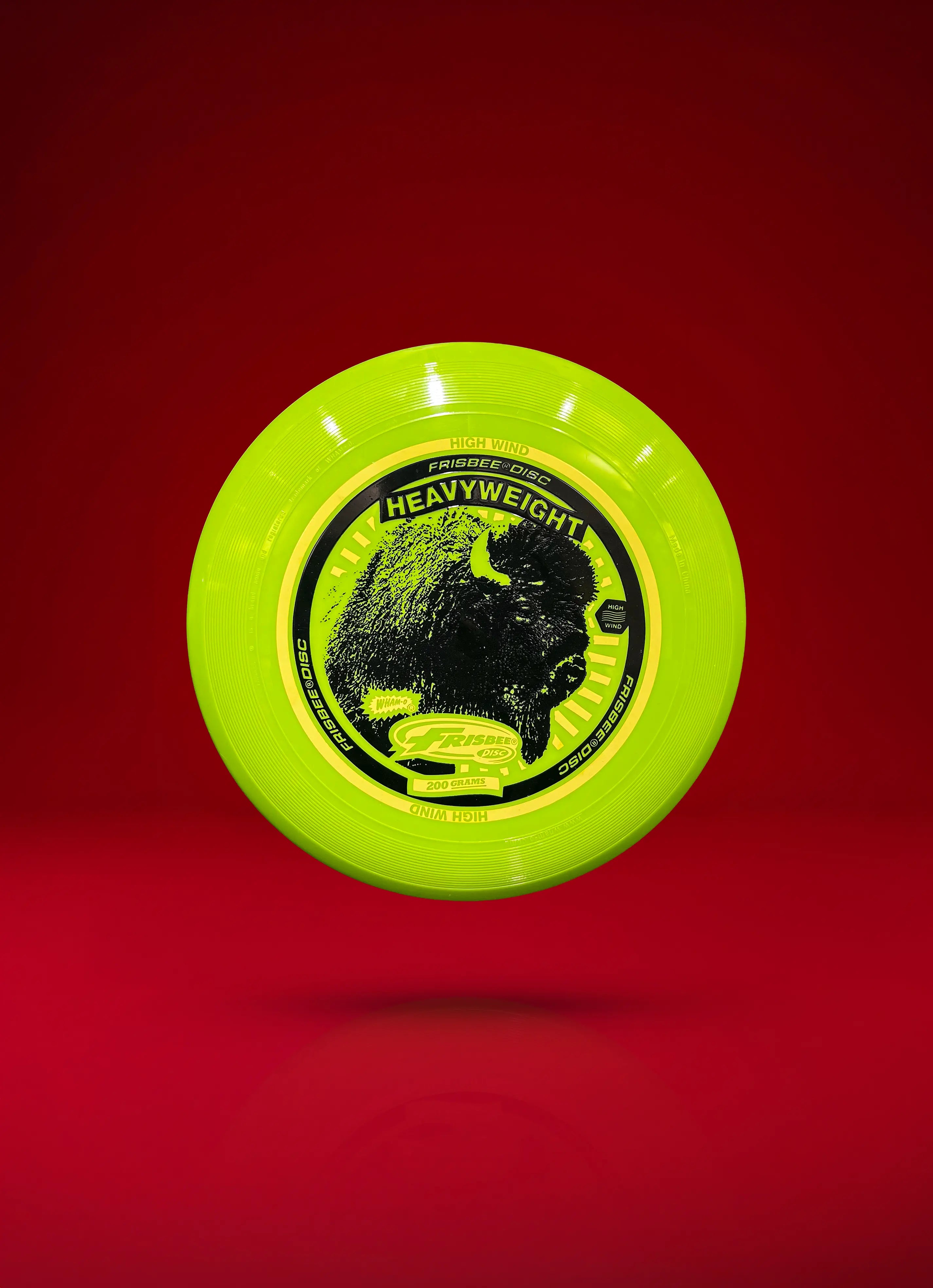 Green heavyweight Frisbee disc with buffalo graphic on red background