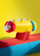Close-up of inflatable Slip 'n Slide Air water sprayer with red, yellow, and blue colors