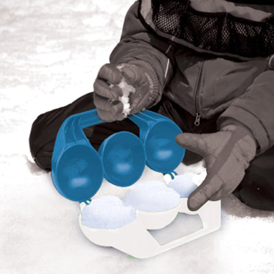 A boy is making snow ball with Wham-O Arctic Force Snowball Maker