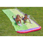 Children are sliding with Wham-O Slip 'N Slide® Surf Rider Double