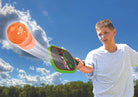 A man is holding and playing Wham-O Game Time! Pickleball Game Set