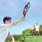Two men are playing with Wham-O Game Time! Trac-Ball® II in the backyard