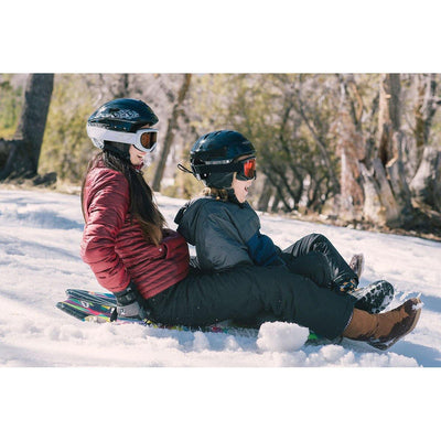 Children are sliding down the snow hill with Wham-O Snowboogie® Alpine Rocket 48"