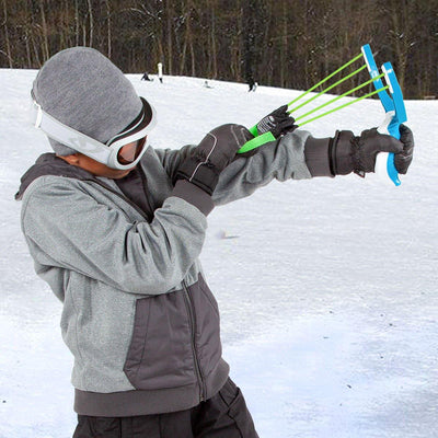 A boy is holding Wham-O Arctic Force Snow Slingshot in snowy day